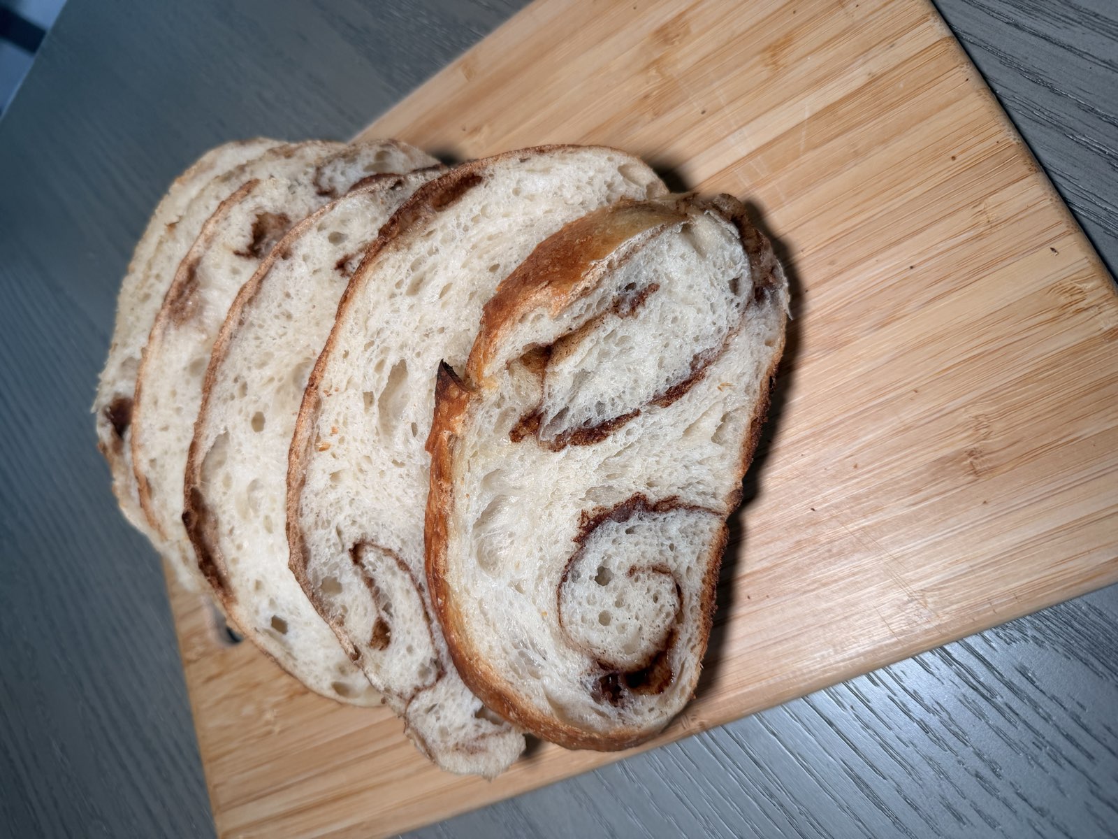 Soft sourdough slices showing a tender, swirled crumb